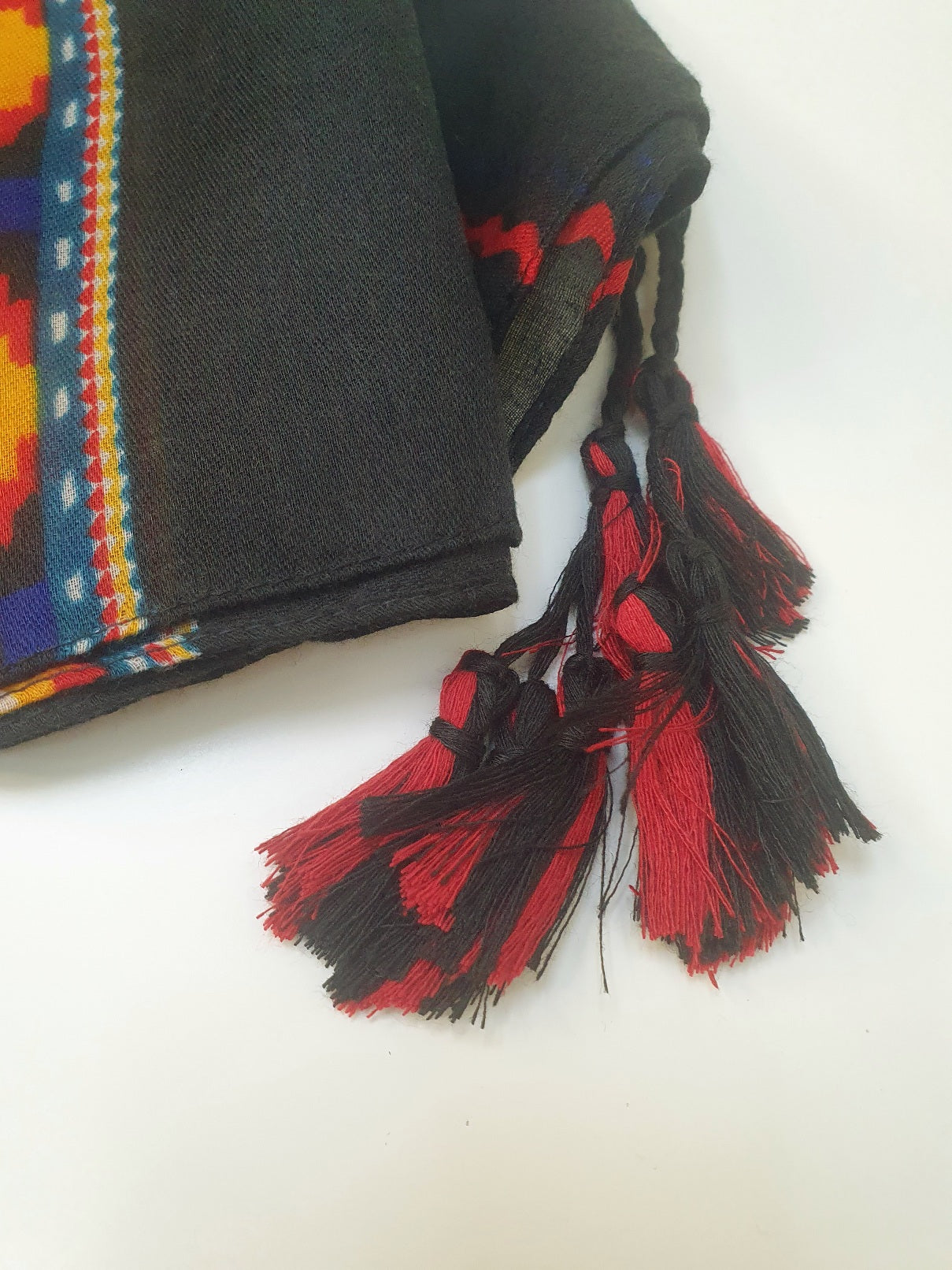 Traditional stole with colorful patterns and tassels