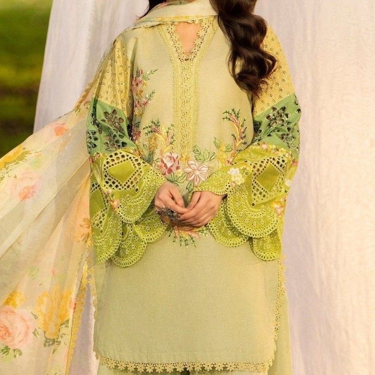 Green lawn stitched suit showing intricate hand-crafted embroidery and elegant silhouette