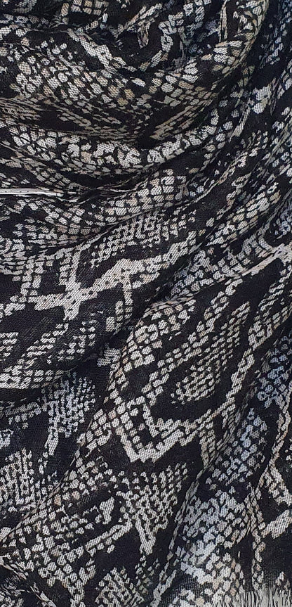 Close-up of black and white patterned J. scarf
