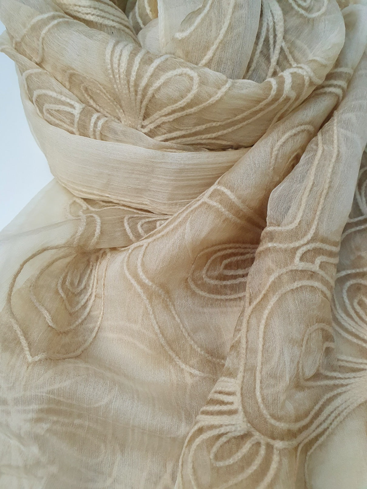 Close-up of beige J. stole-Online UAE