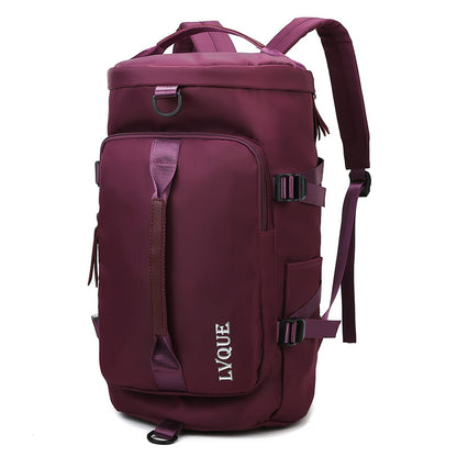 A magenta bag cum backpack with a zipper closure, multiple compartments, adjustable straps and multiple carrying options