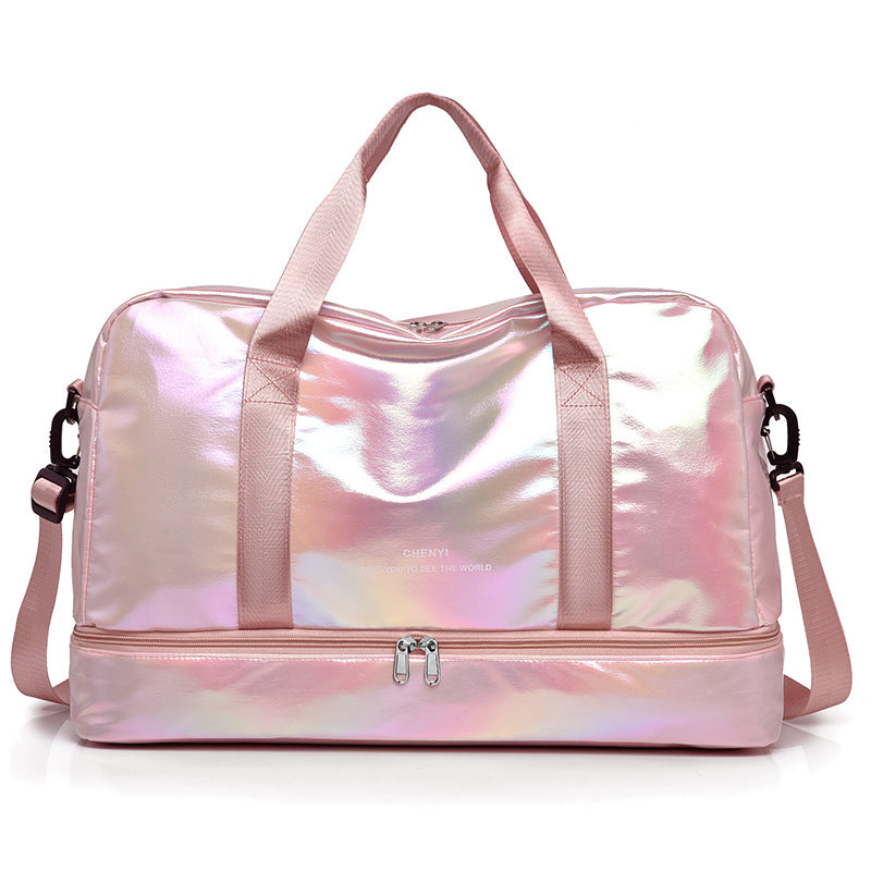 Iridescent pink duffel bag with a glossy holographic finish and adjustable shoulder strap, featuring a shoe compartment.