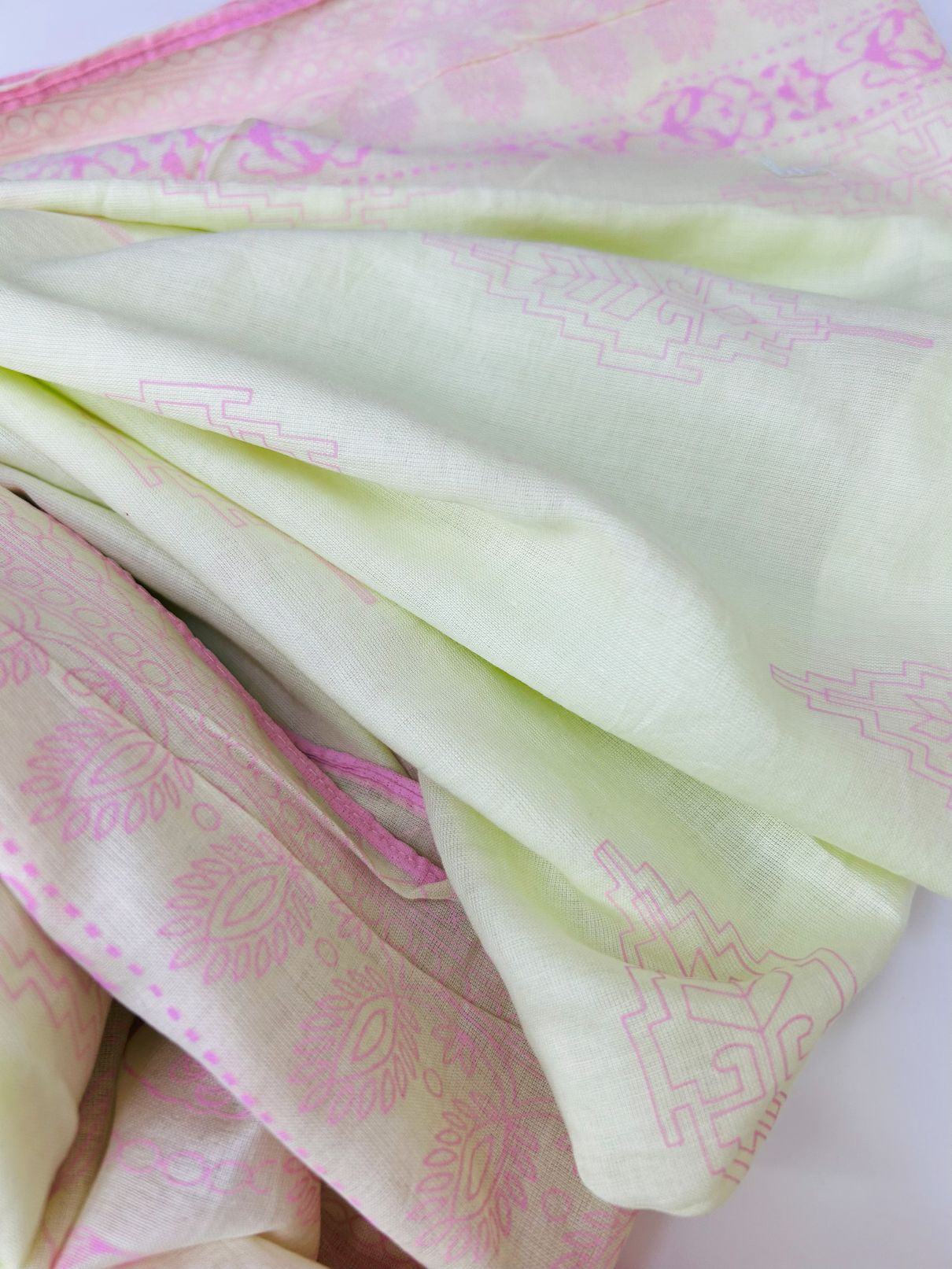 Close-up of light green Lawn Dupatta with pink floral patterns by J.- Khaas Trends Online UAE
