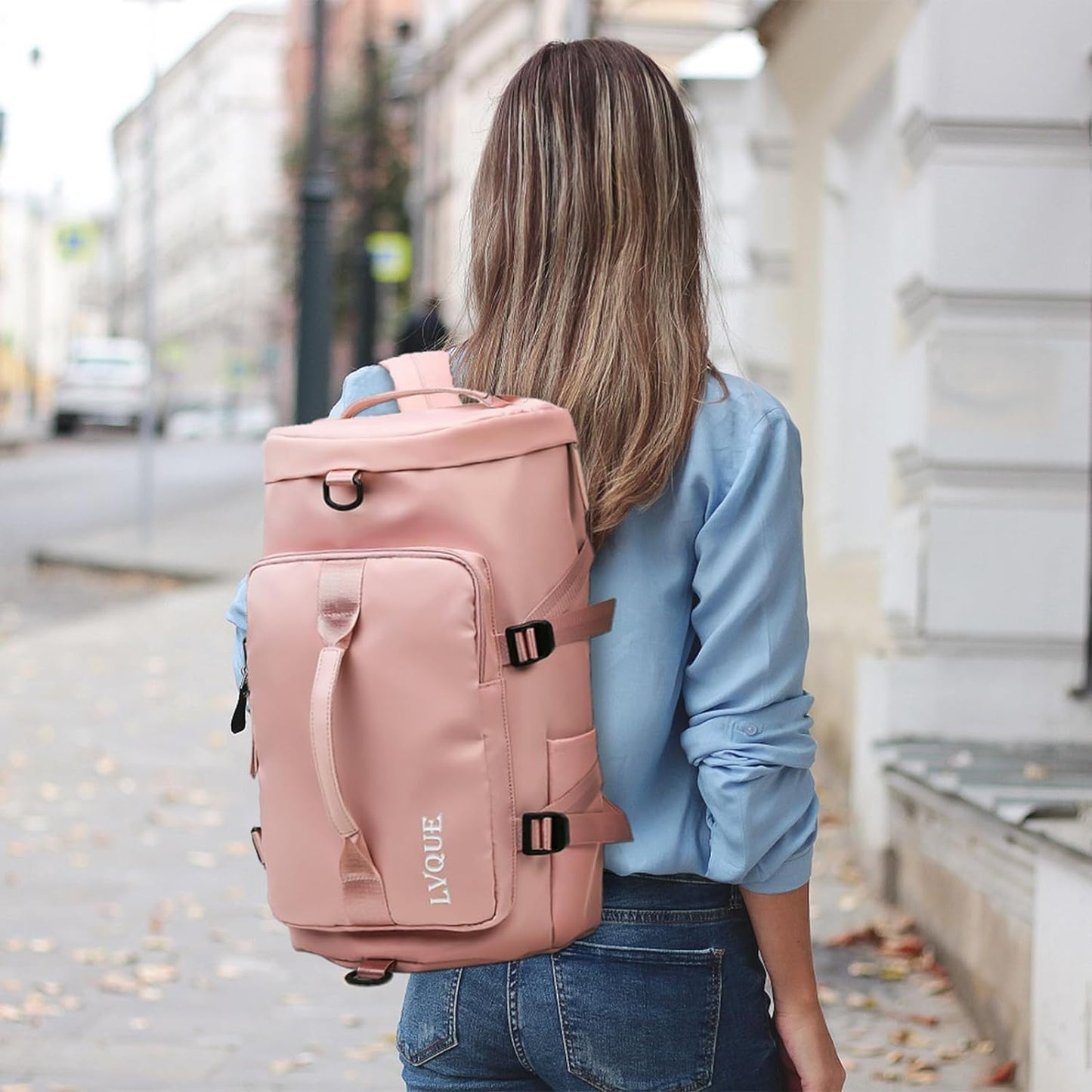 A pink bag cum backpack with a zipper closure, multiple compartments, adjustable straps and multiple carrying options-Dubai