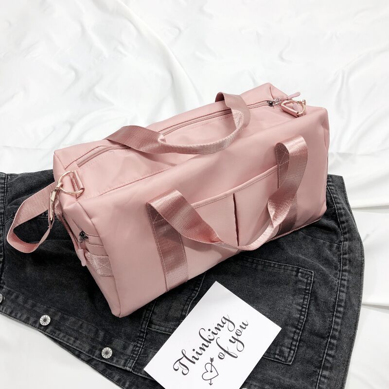A pink travel and gym bag with multiple compartments-Online Khaas Trends