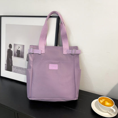 purple shoulder bag with multiple pockets