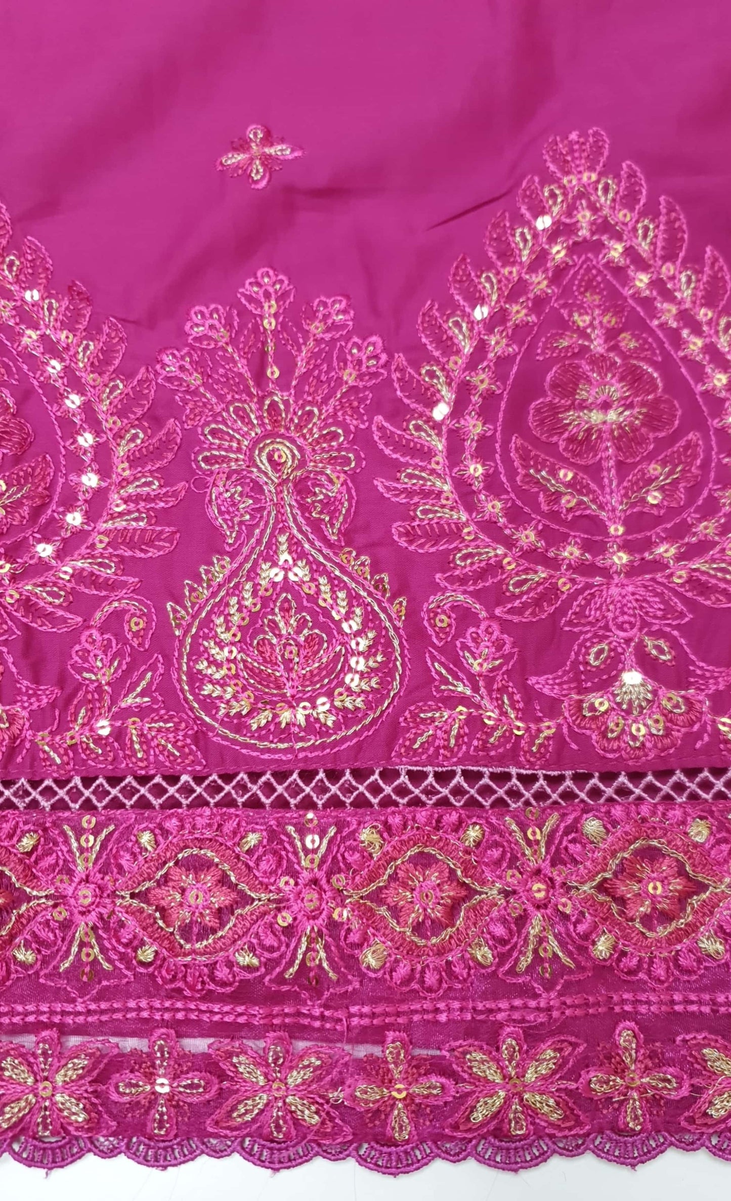 Close-up of a pink shirt Daman with intricate gold embroidery