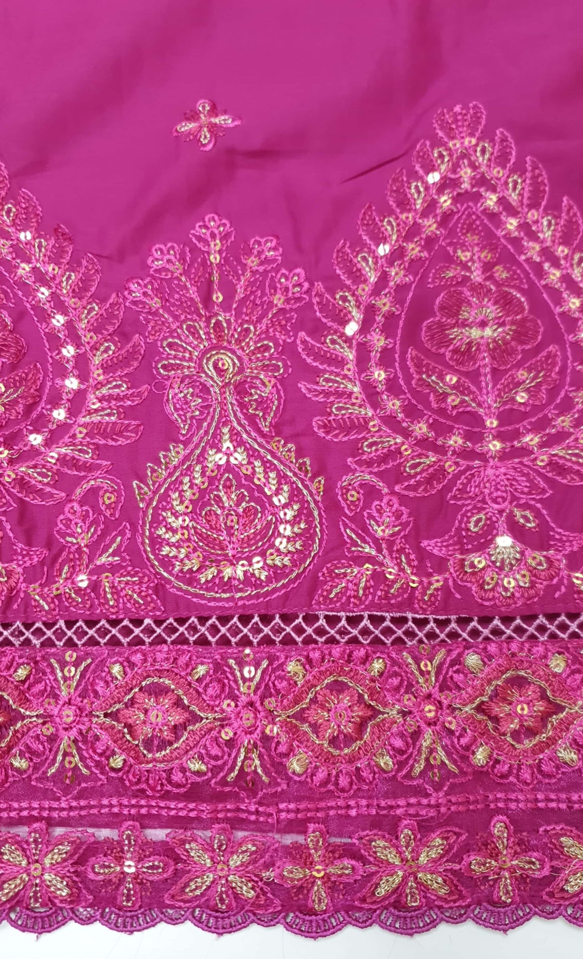 Close-up of a pink shirt Daman with intricate gold embroidery