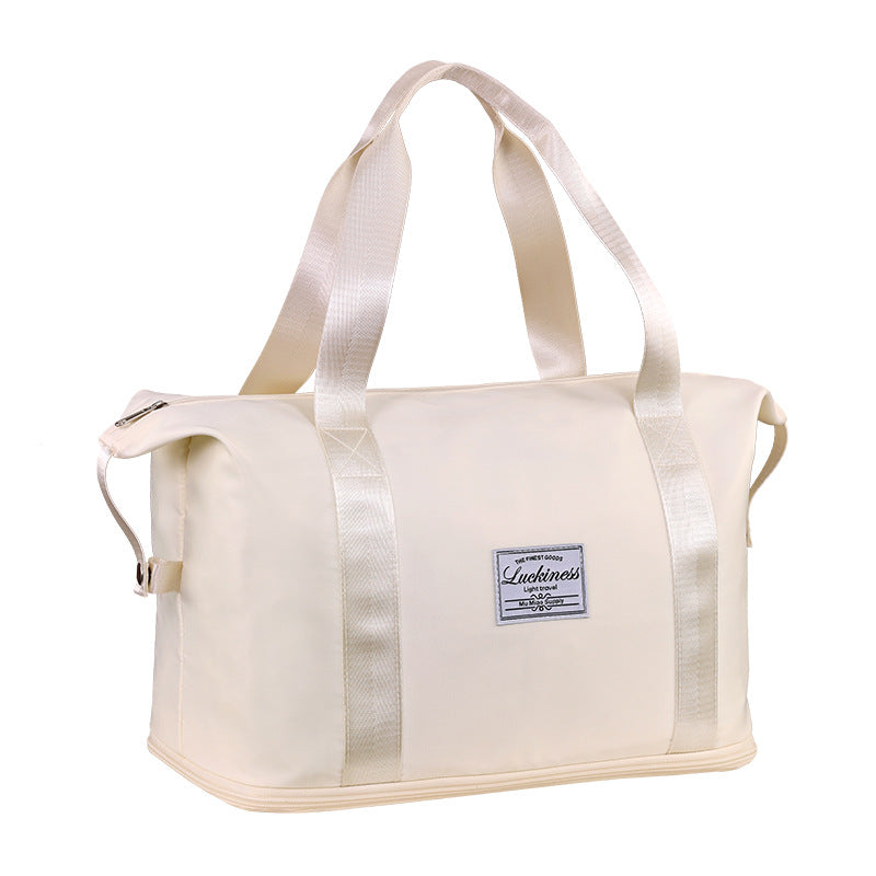 A beige single extension gym bag with a large capacity and dual handles.